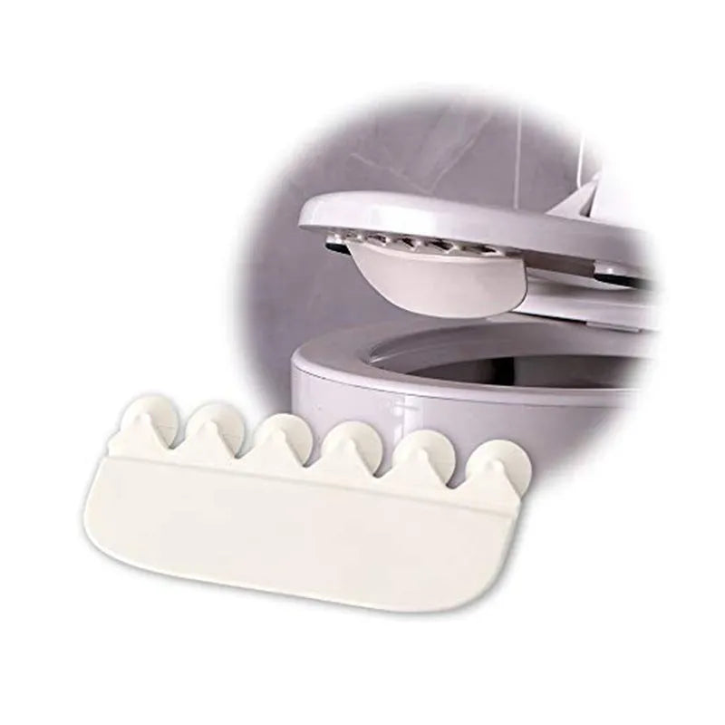 White PVC urine blocking splash guard for toilet training, shown on a toilet seat.