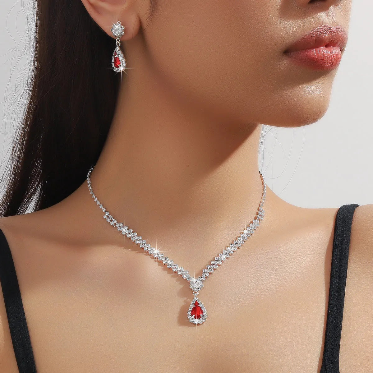 Claw chain necklace and earrings set with rhinestone water drops in multiple colour options