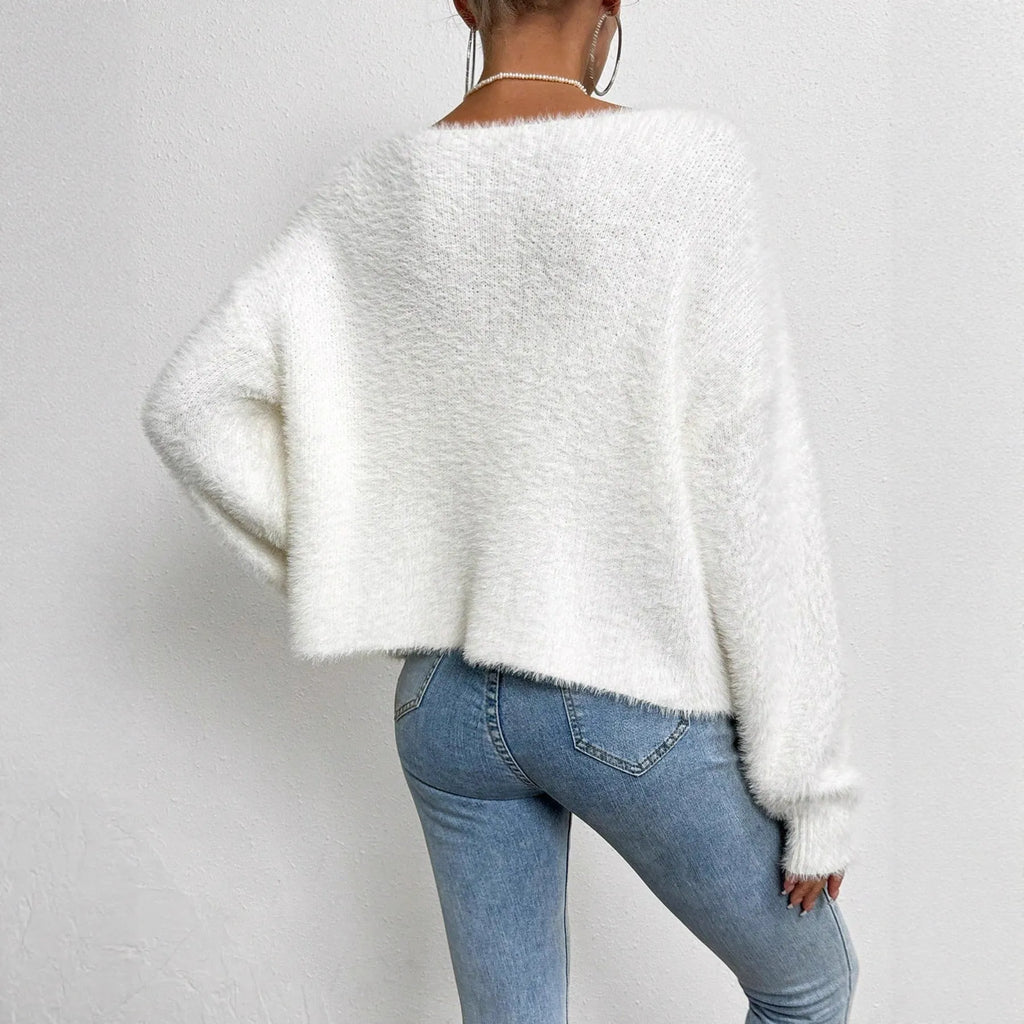 White women's V-neck cardigan with regular length polyester knit construction