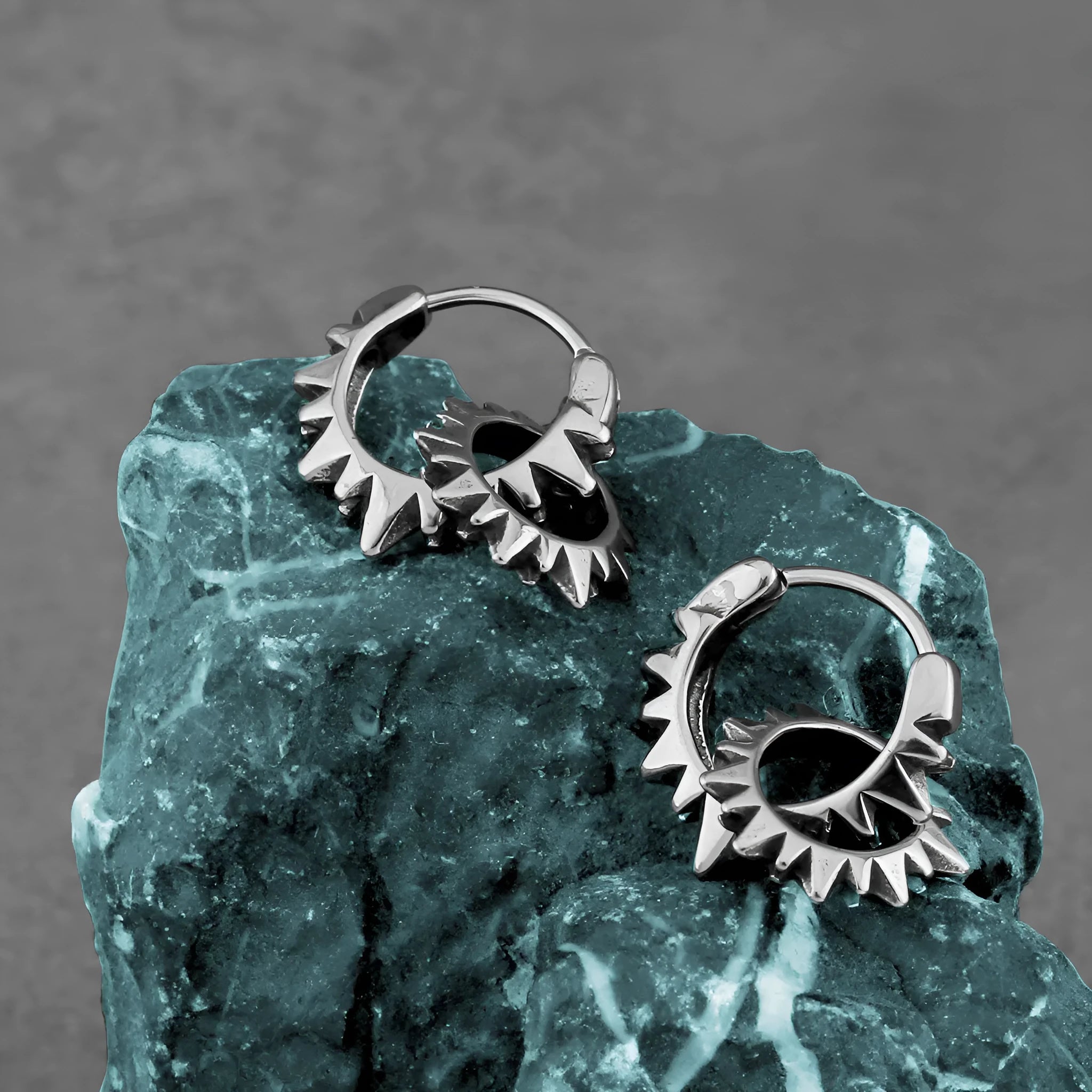 Polished stainless steel retro hoop earrings with round ring design in steel colour.