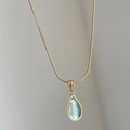 Retro water drop necklace with titanium steel chain and blue or green gemstone pendant