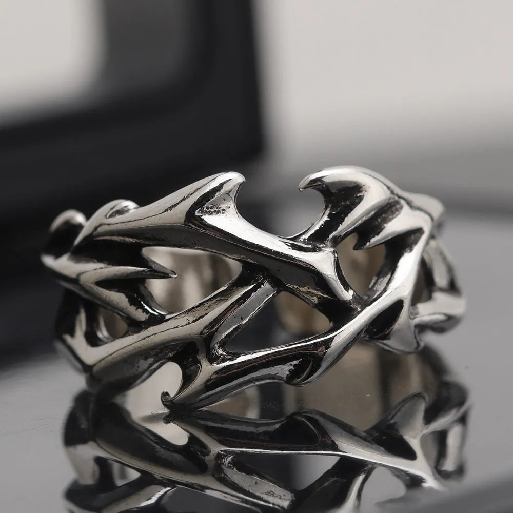 Men's adjustable copper ring featuring a geometric flower with thorn detailing in J2150 colour.