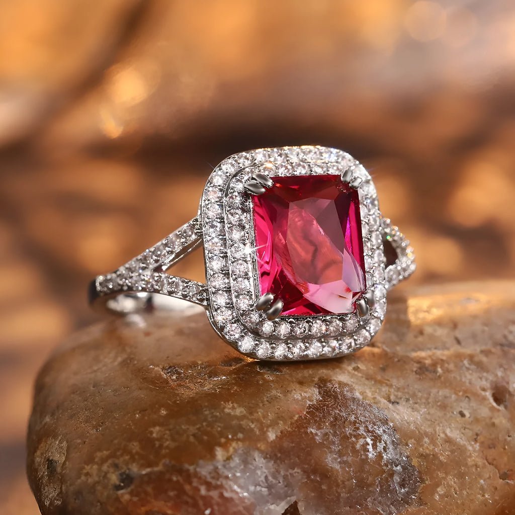 Red geometric square copper women's ring with a central princess stone setting.