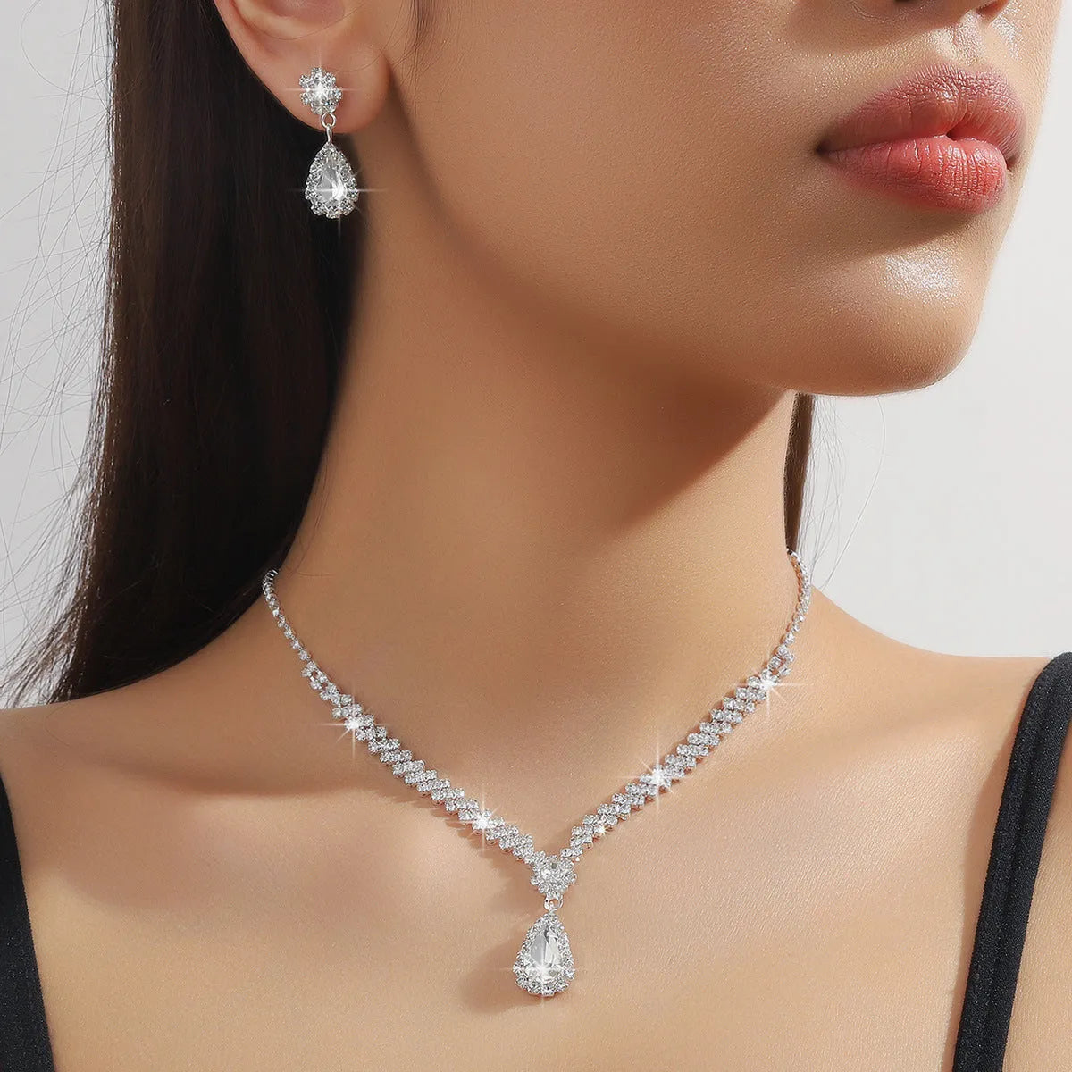 Claw chain necklace and earrings set with rhinestone water drops in multiple colour options