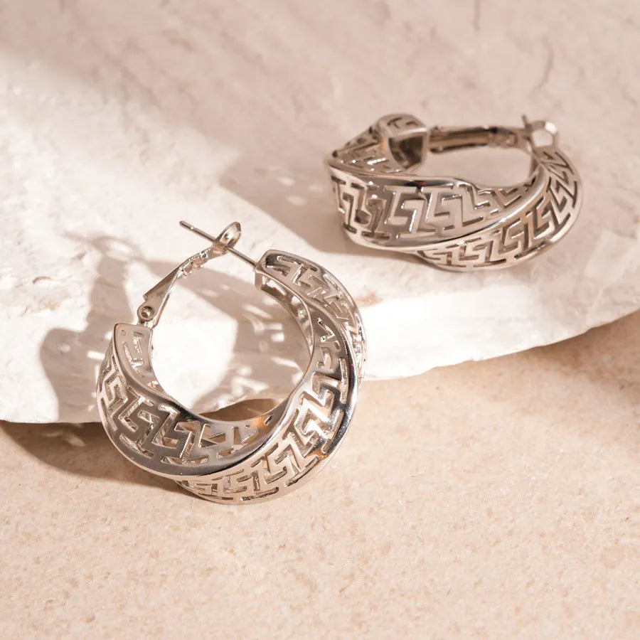 Geometric hollow stud earrings with twisted round design in gold or silver electroplated finish
