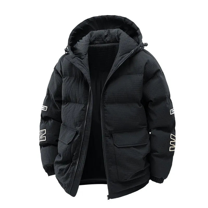 Man wearing a black hooded winter coat with letter print and side pockets, styled as a Korean cardigan.