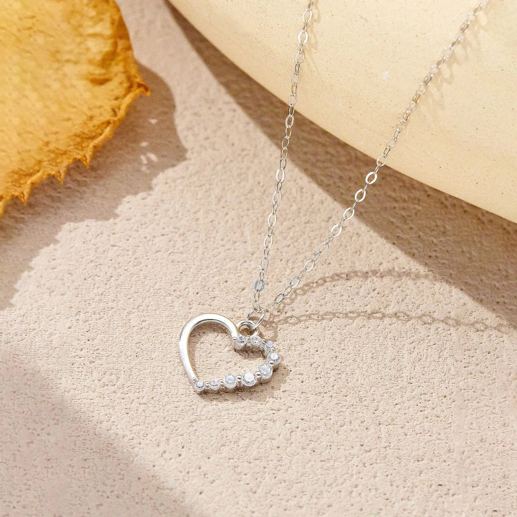 S925 sterling silver hollow heart and circle pendant necklace on a regular chain for women.