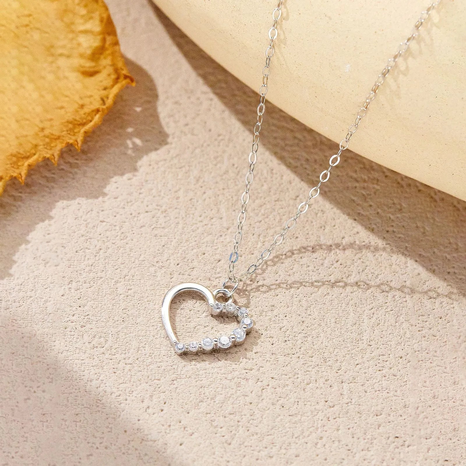 S925 sterling silver hollow heart and circle pendant necklace on a regular chain for women.