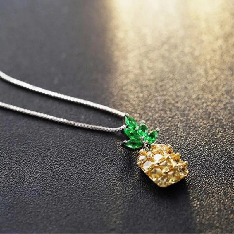 Silver geometric pineapple pendant necklace with diamond motif on chain