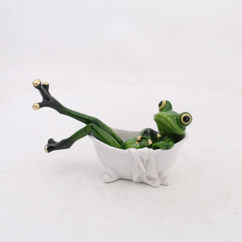 Pastoral style green resin frog decoration figurine on a wooden shelf.