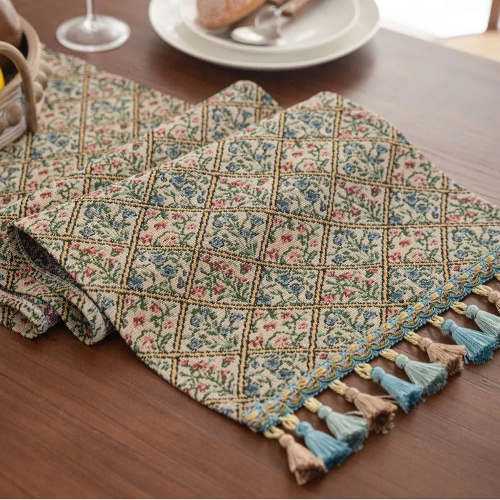 Rhyme Nordic Jacquard table runner with bouquet stripe pattern and tassel trim on dining table