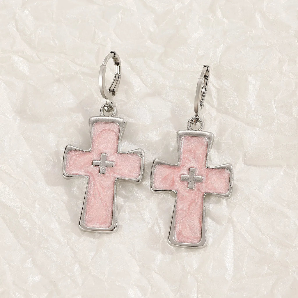 Women's alloy earrings showing cross, heart, and cat designs in white, black, and antique silver finishes.