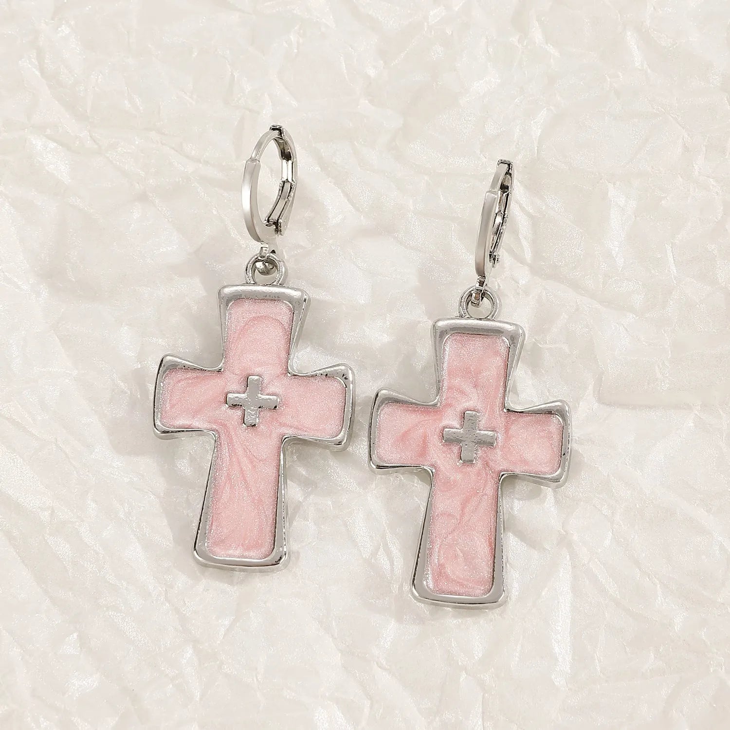 Women's alloy earrings showing cross, heart, and cat designs in white, black, and antique silver finishes.