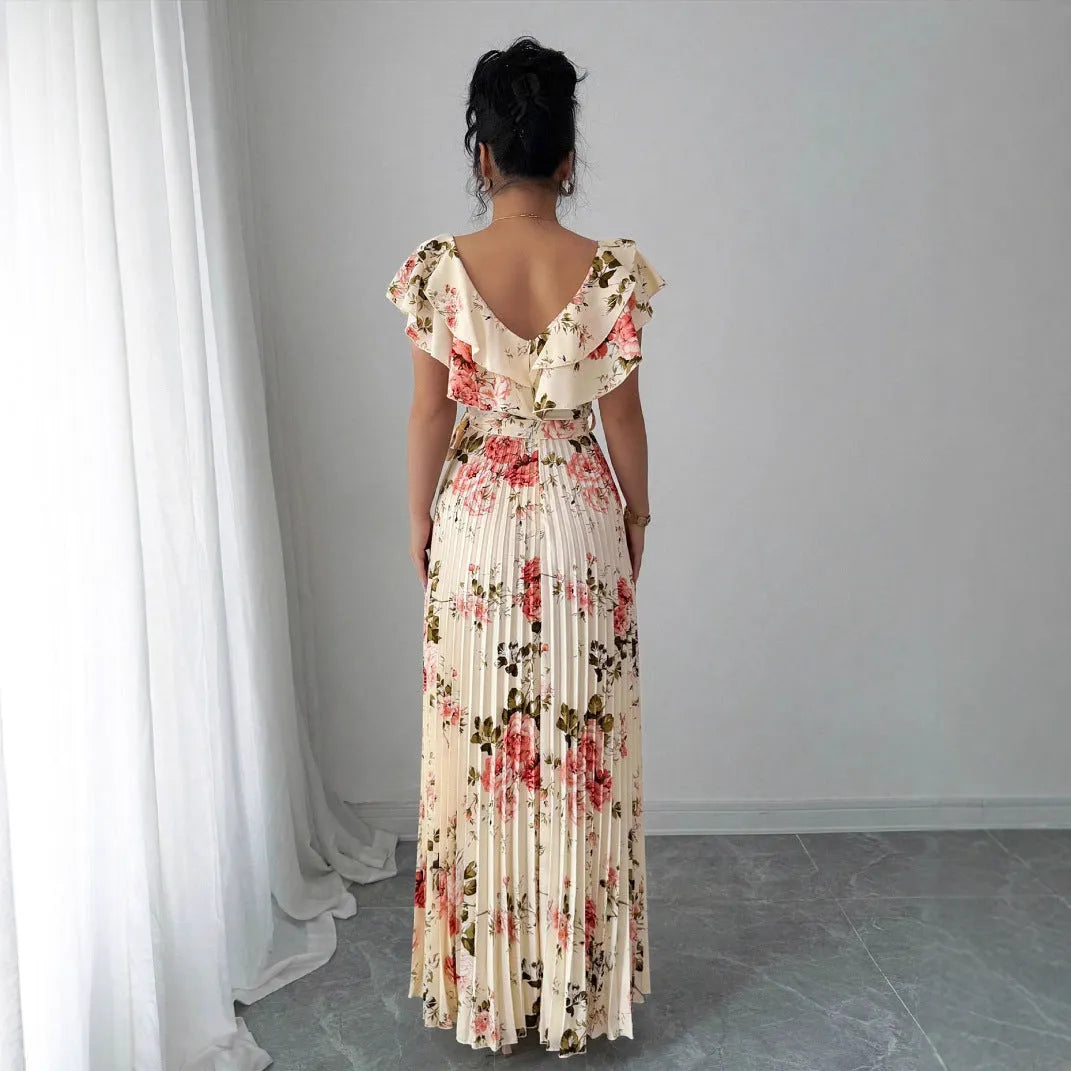 Apricot coloured floral print V-neck dress with ruffle sleeves and a flowing swing skirt.