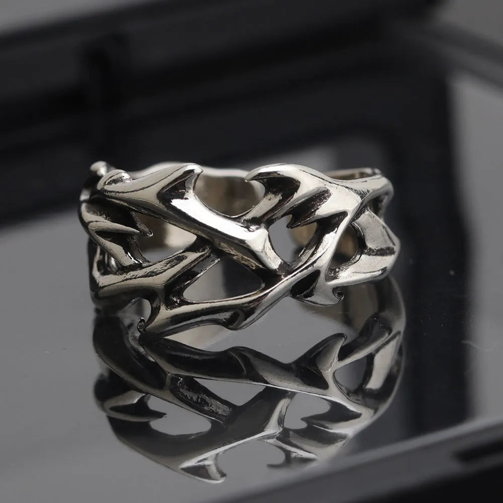 Men's adjustable copper ring featuring a geometric flower with thorn detailing in J2150 colour.
