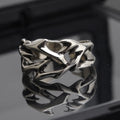 Men's adjustable copper ring featuring a geometric flower with thorn detailing in J2150 colour.