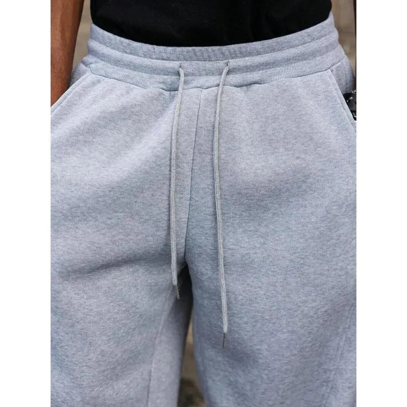 Men's straight-leg high-waist trousers in a cropped length, shown in a dark grey colour.
