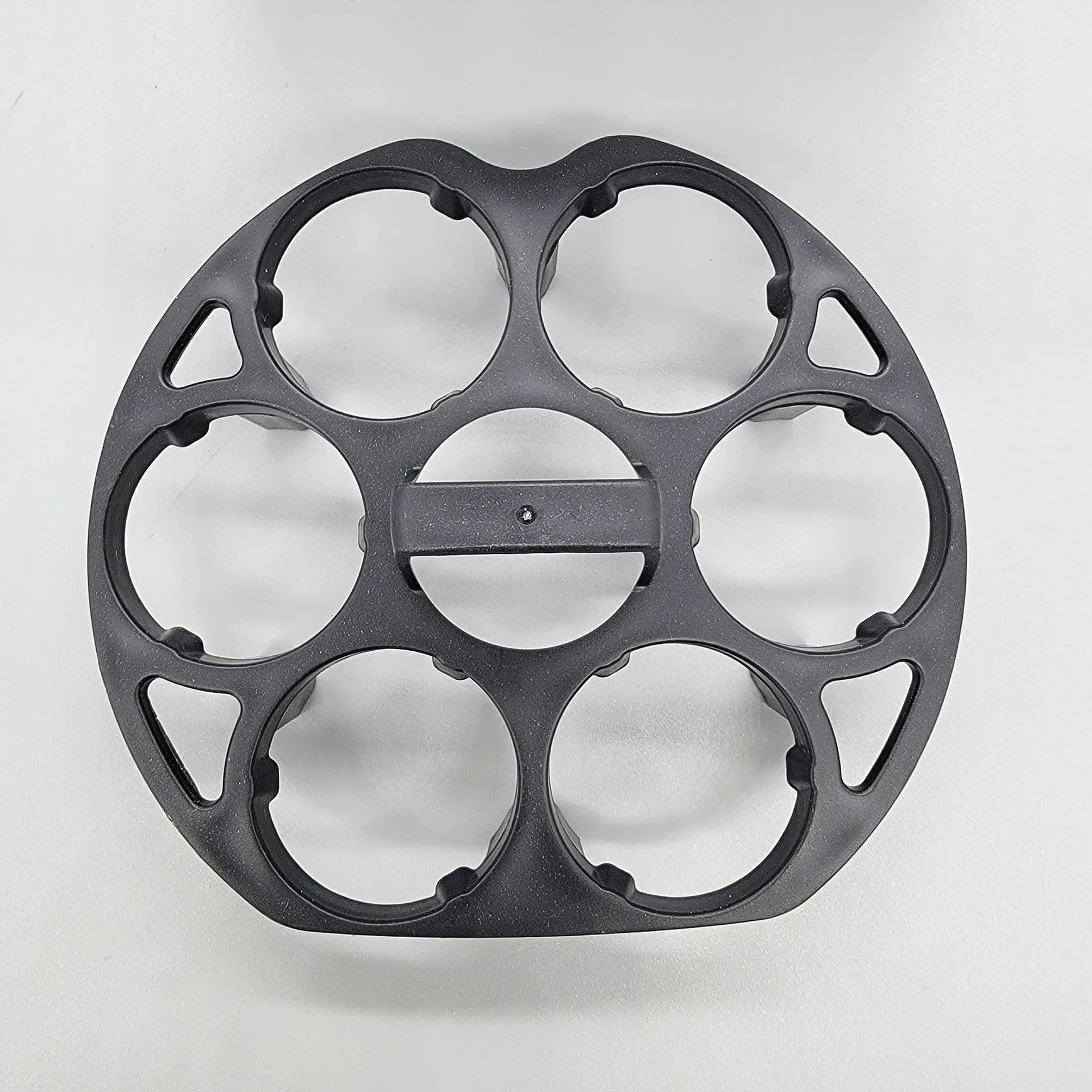 Black plastic egg holder keeper basket for kitchen storage, showing compact size.