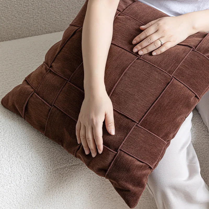 50cm square chenille woven pillow cushion in a choice of seven colours on a sofa.