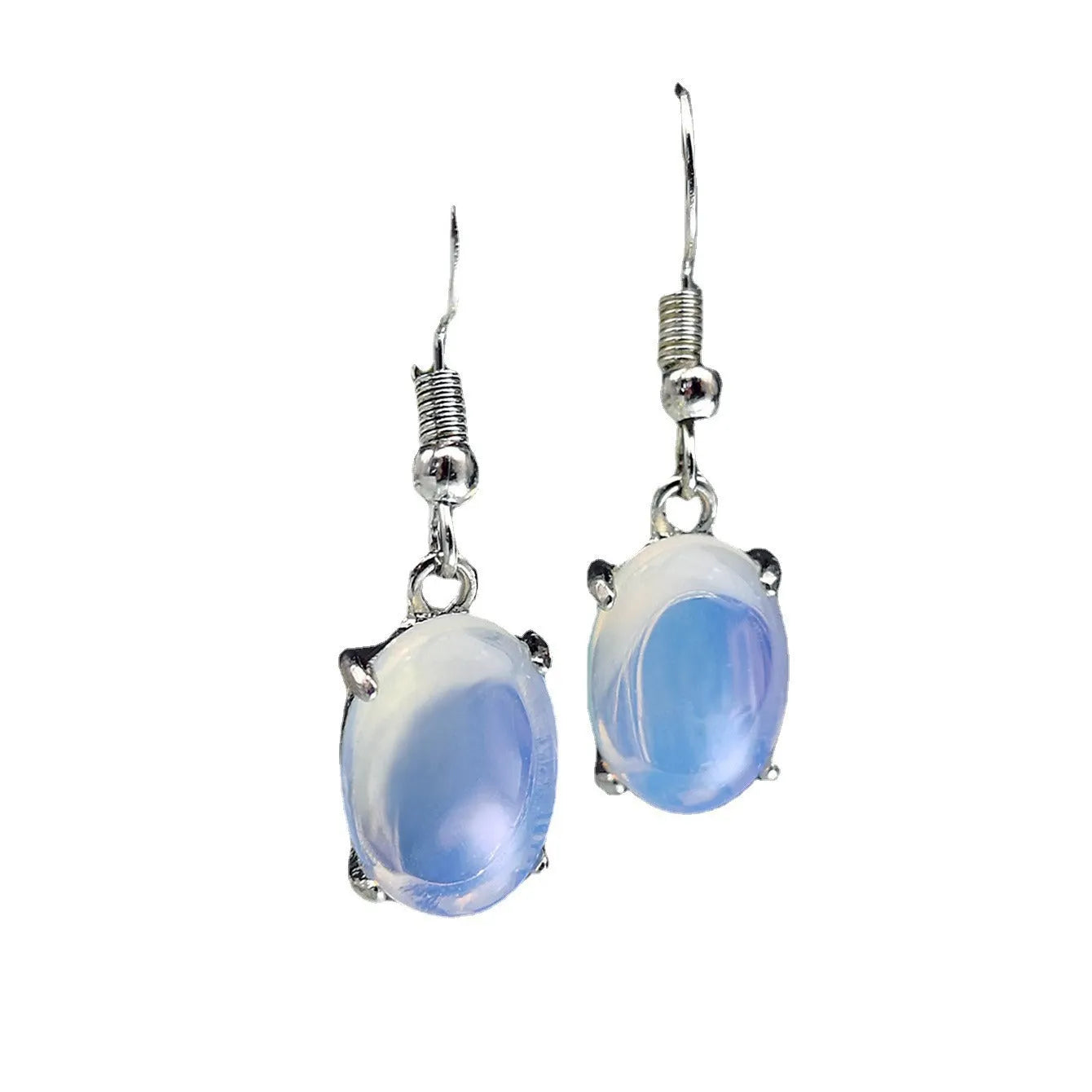 Moonlight white opal earrings with cross pendant and drop shape on retro moonstone style background