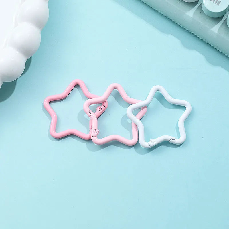 Zinc alloy five-pointed star keychain in light pink colour for backpack decoration