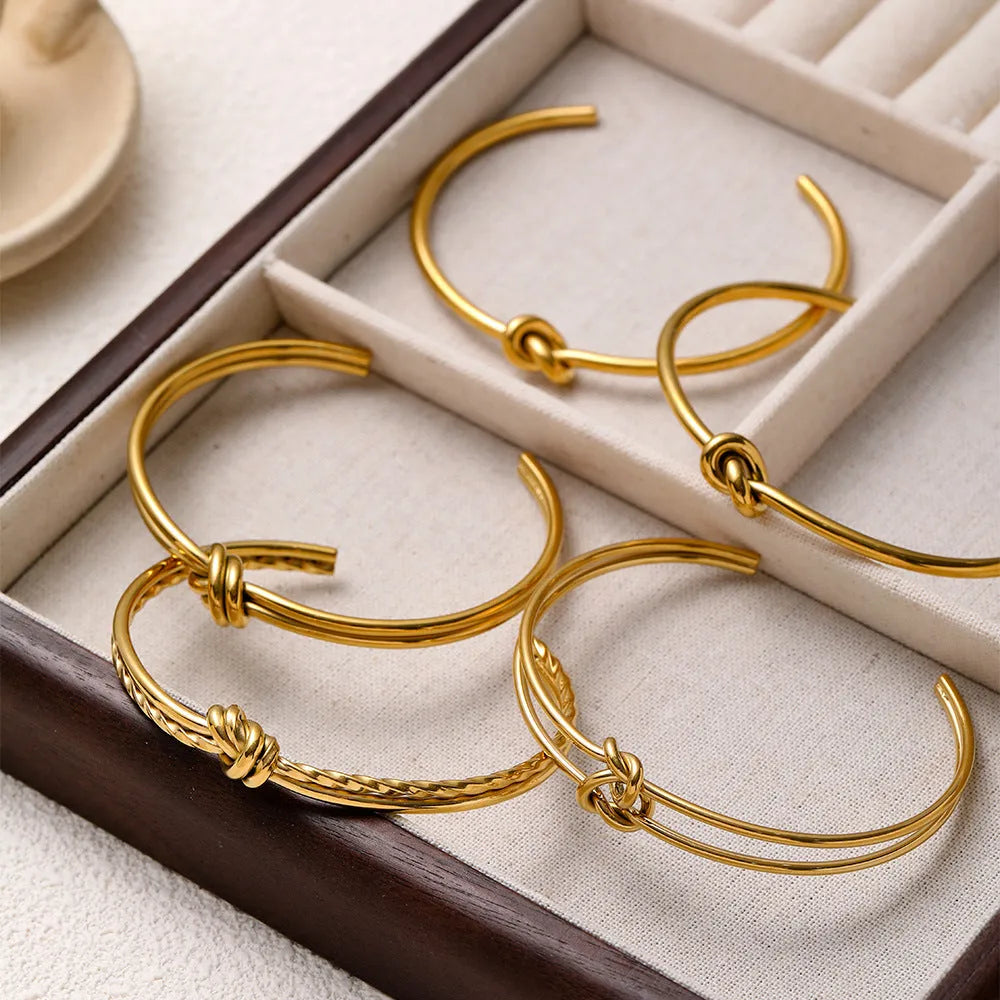 Stainless steel women's bracelet with knotted C-shaped open design and double-layer construction in gold or silver