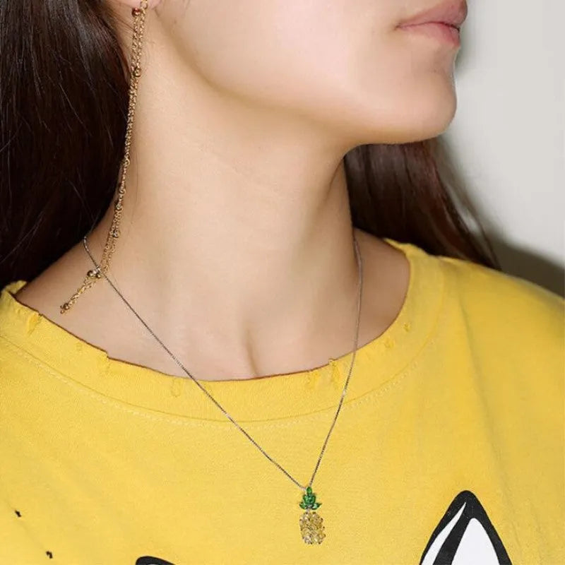 Silver geometric pineapple pendant necklace with diamond motif on chain