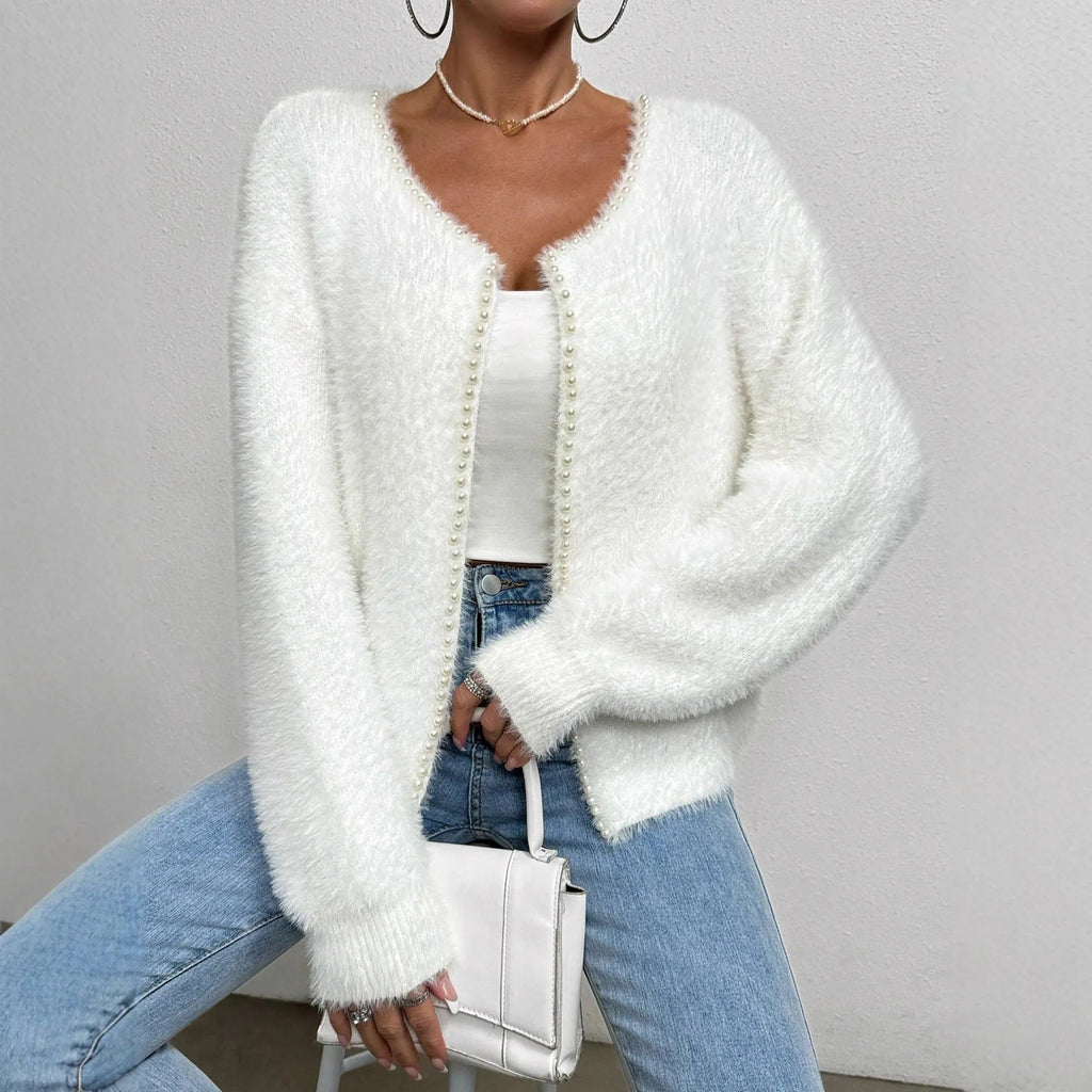 White women's V-neck cardigan with regular length polyester knit construction