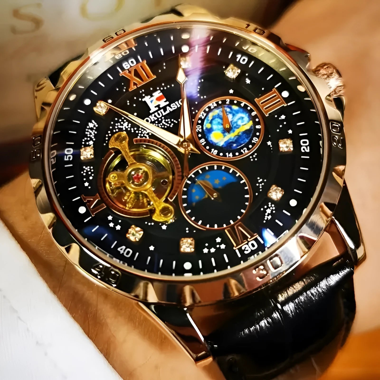 Men's automatic mechanical watch with hollow dial, rose gold case, black leather strap.