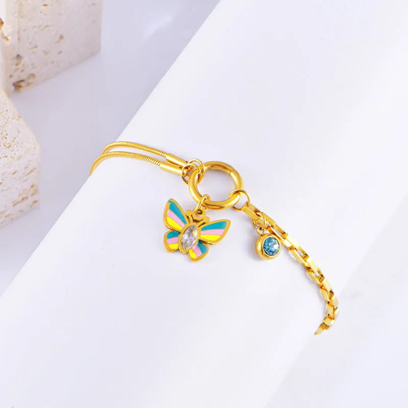 Gold titanium steel butterfly necklace and bracelet set with epoxy colour detailing on animal zodiac pendant