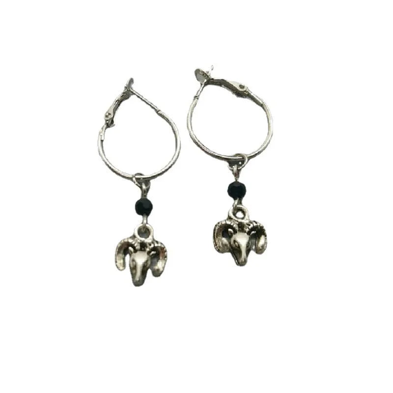 Silver-colour alloy earrings with a round ring Tibetan antelope design for women.