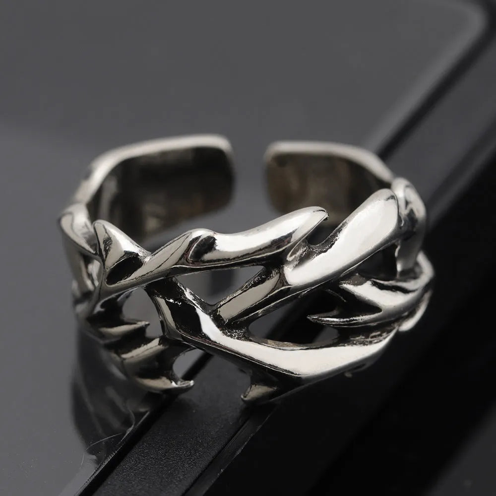 Men's adjustable copper ring featuring a geometric flower with thorn detailing in J2150 colour.
