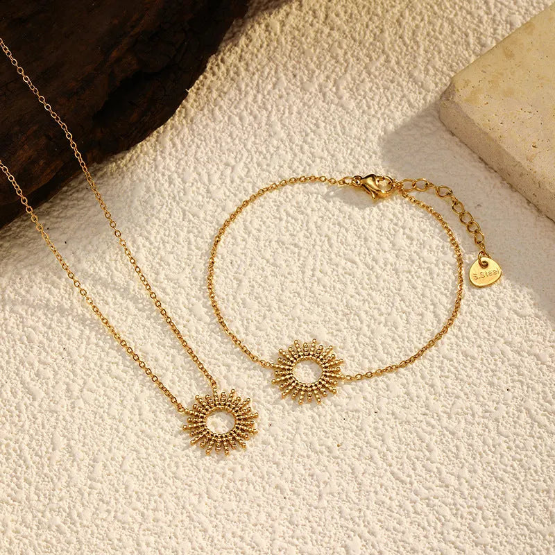 Gold geometric necklace and bracelet set with stainless steel construction and chain designs