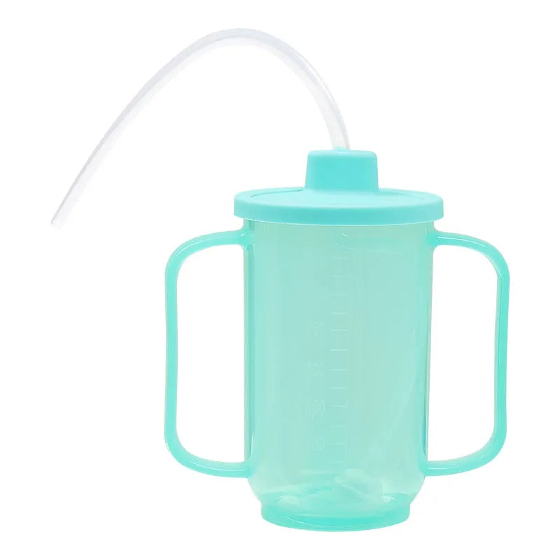 Oblique mouth choke-proof drinking cup for adults with handle and lid, shown with optional wrist splint.