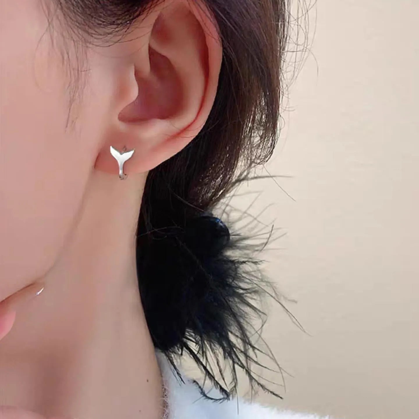 A pair of simple fishtail design earrings in a choice of white gold or yellow gold colour.
