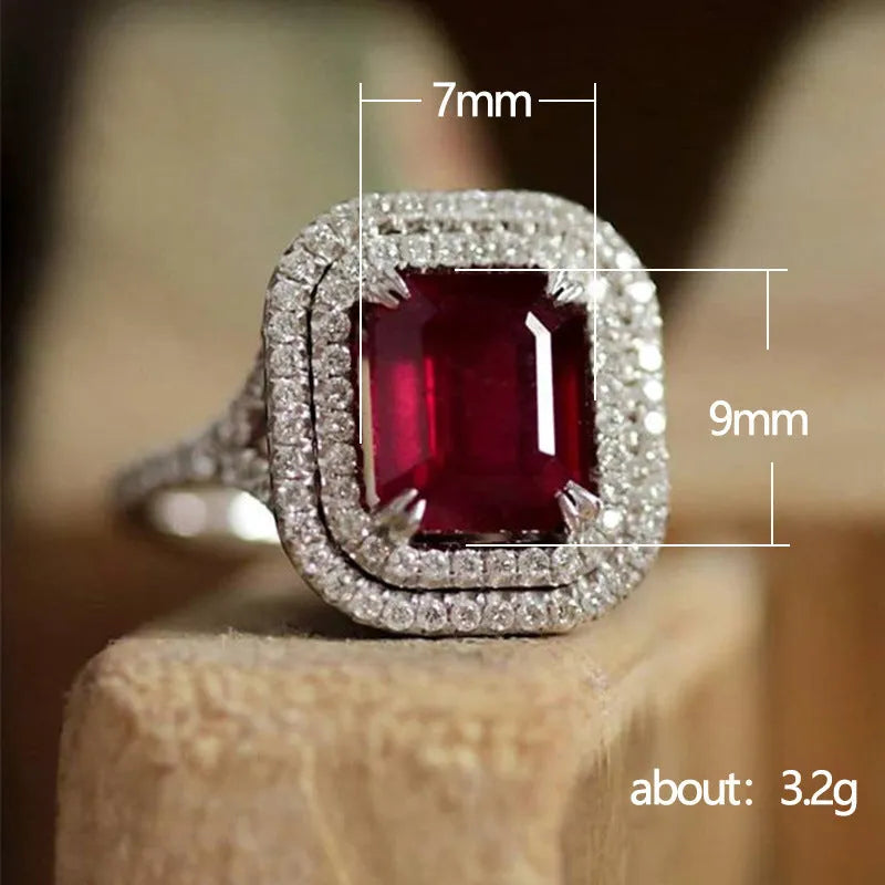 Red geometric square copper women's ring with a central princess stone setting.