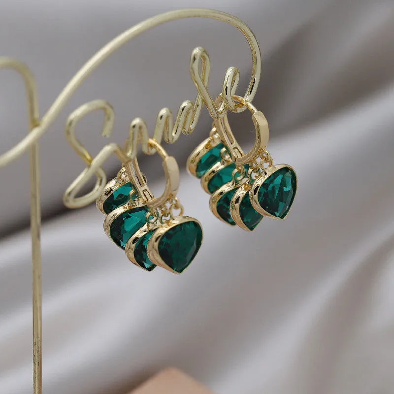 Green heart-shaped clip earrings with alloy inlaid gemstone details in Korean style