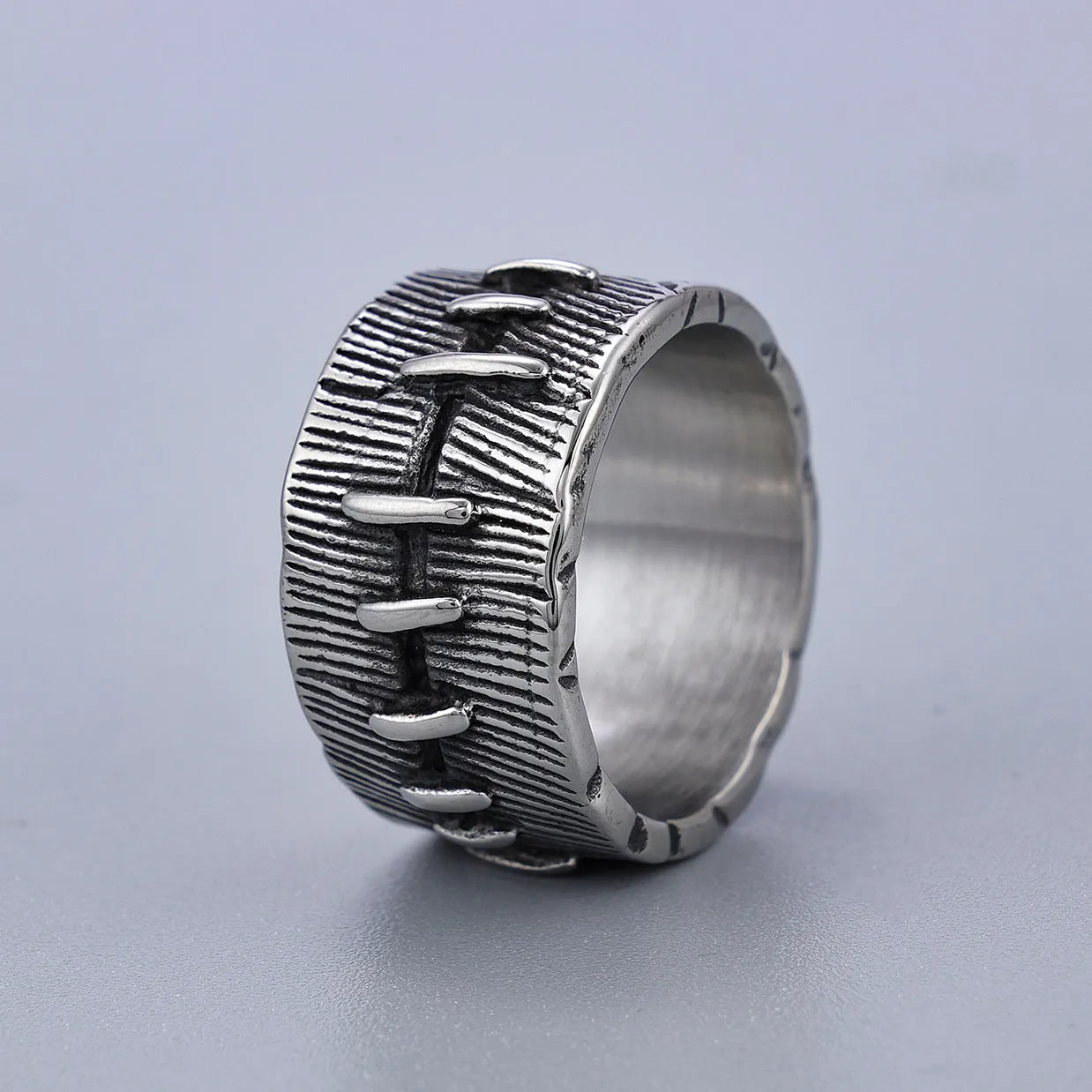 Dark punk-style geometric titanium steel double ring in retro colour on a U-shaped band.