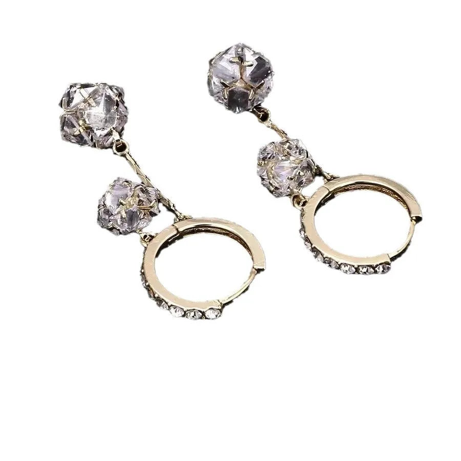 Women's silver tone drop earrings with tassel ball and rhinestone ball double pendant design