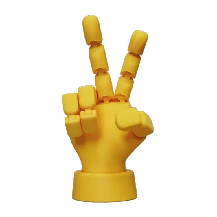 Yellow articulated hand props with movable joints measuring 5x5.38x7.5cm
