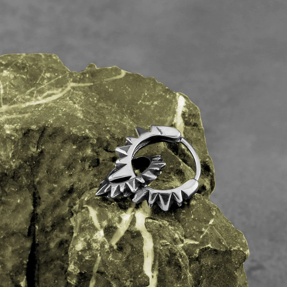 Polished stainless steel retro hoop earrings with round ring design in steel colour.