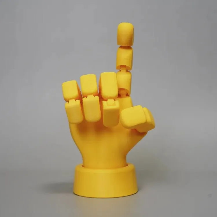 Yellow articulated hand props with movable joints measuring 5x5.38x7.5cm