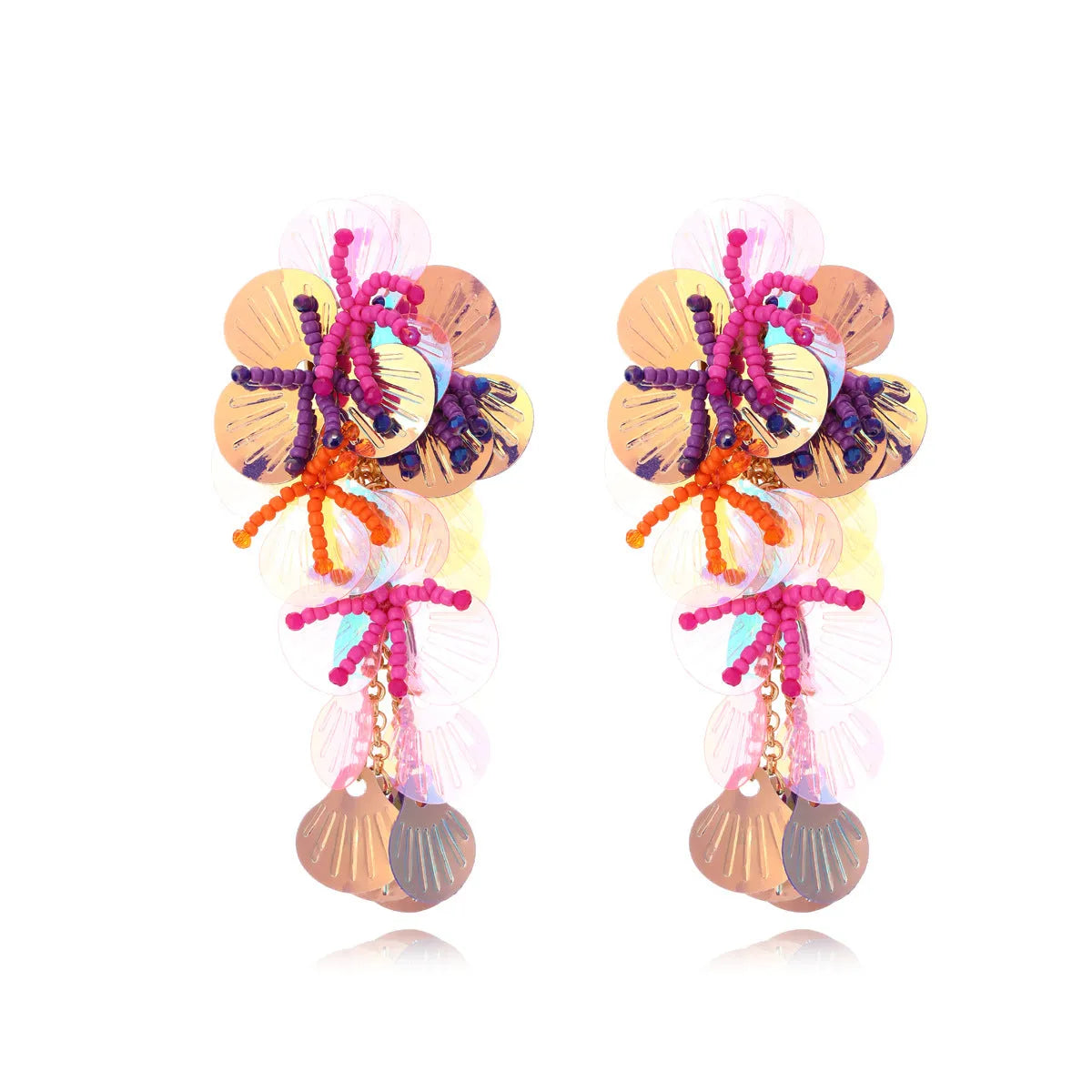 Close-up of handmade purple and green bead flower earrings with leaf details on a white background.