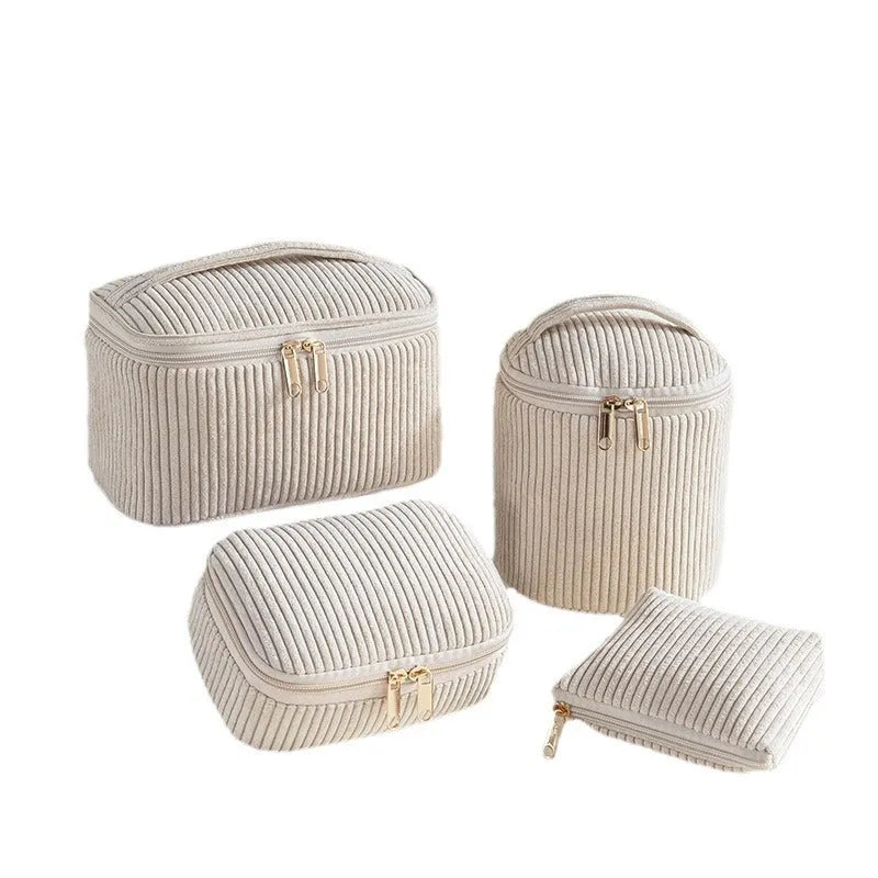 Four cube-style flannelette makeup bags in coordinating colours showing portable cosmetic organiser set