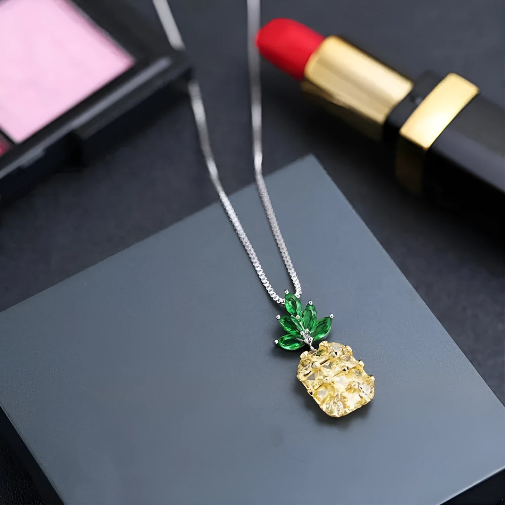 Silver geometric pineapple pendant necklace with diamond motif on chain
