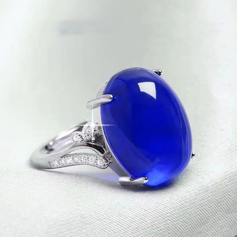 Adjustable geometric alloy ring with a natural sapphire style, shown in multiple colour options.