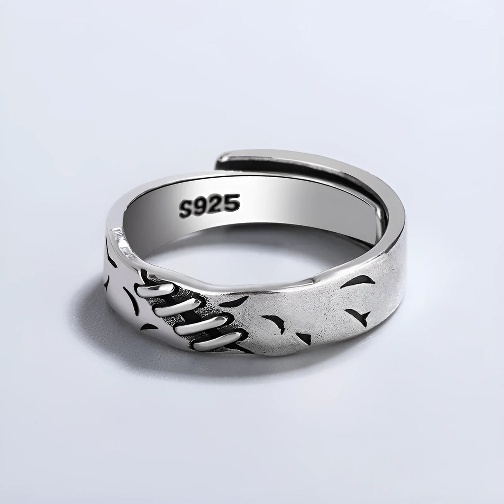 Black geometric copper ring with an adjustable opening on a white background.