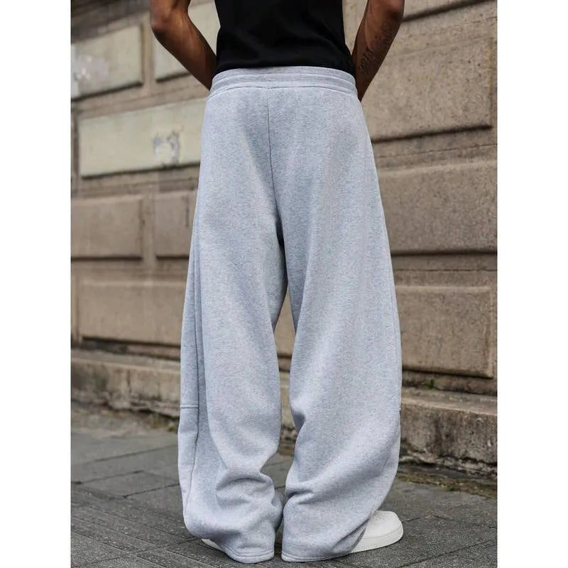 Men's straight-leg high-waist trousers in a cropped length, shown in a dark grey colour.