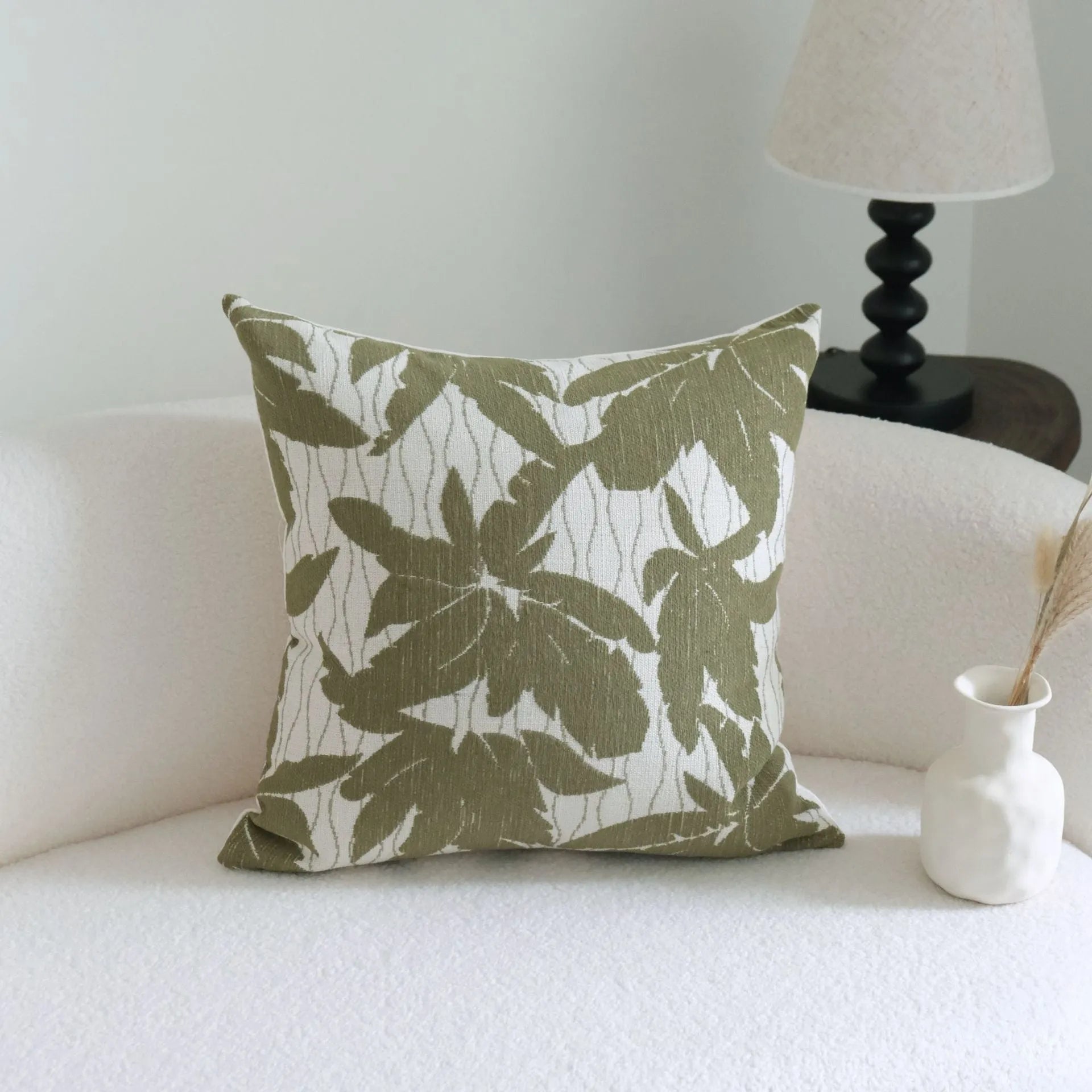 Green cotton and linen hotel sample pillow with silk floss filler in striped and botanical patterns