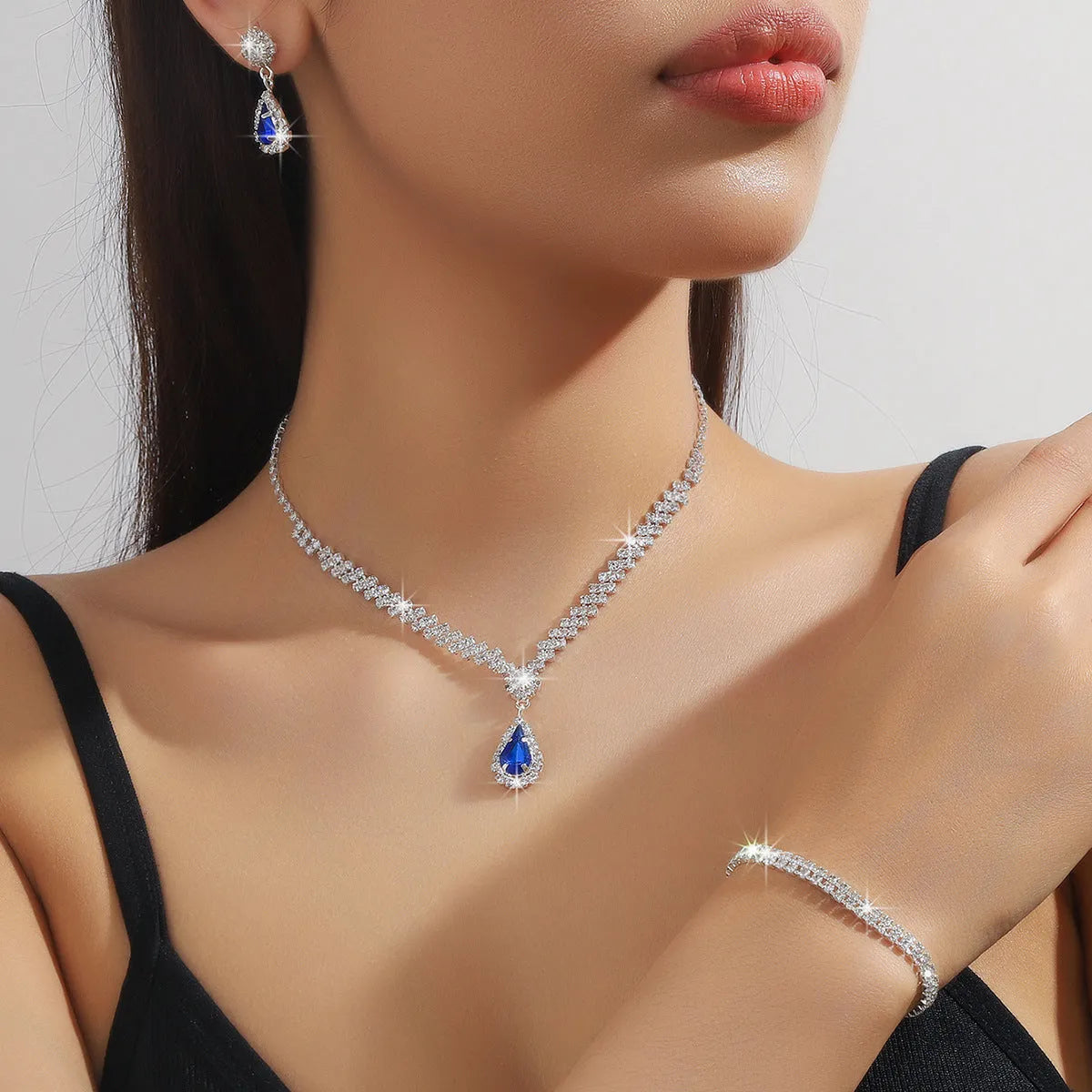 Claw chain necklace and earrings set with rhinestone water drops in multiple colour options